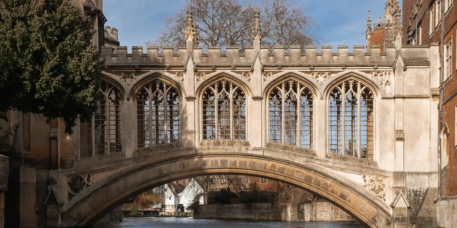 The Bridge of Sighs, an ornately carved, arched stone bridge, as viewed from the river.