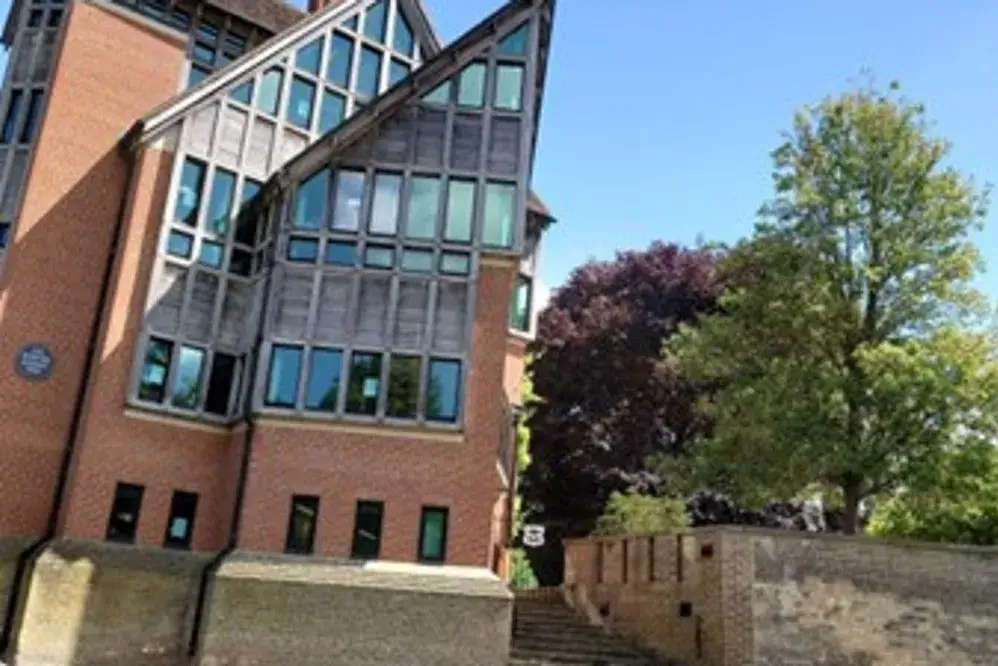 The Jerwood Library, a brick and glass building with a peculiar tiered structure.