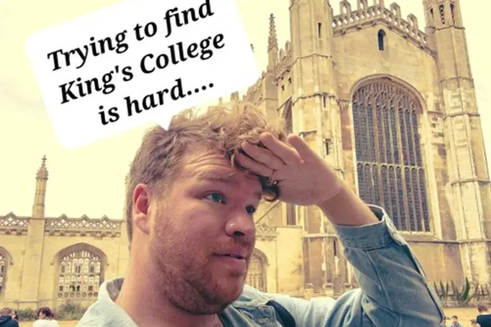 A confused-looking man searching for something, with the King's College buildings prominent in the background. A caption reads "Trying to find King's College is hard..."