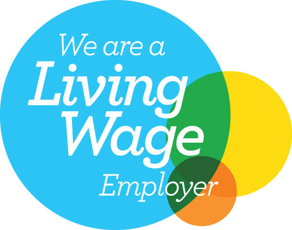 Colorful overlapping circles with text overlaid on top reading "we are a living wage employer"
