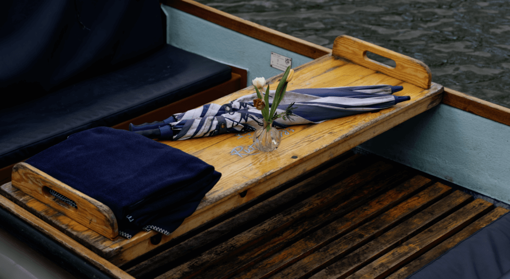 Flowers and an umbrella on a Rutherford's Punting Boat