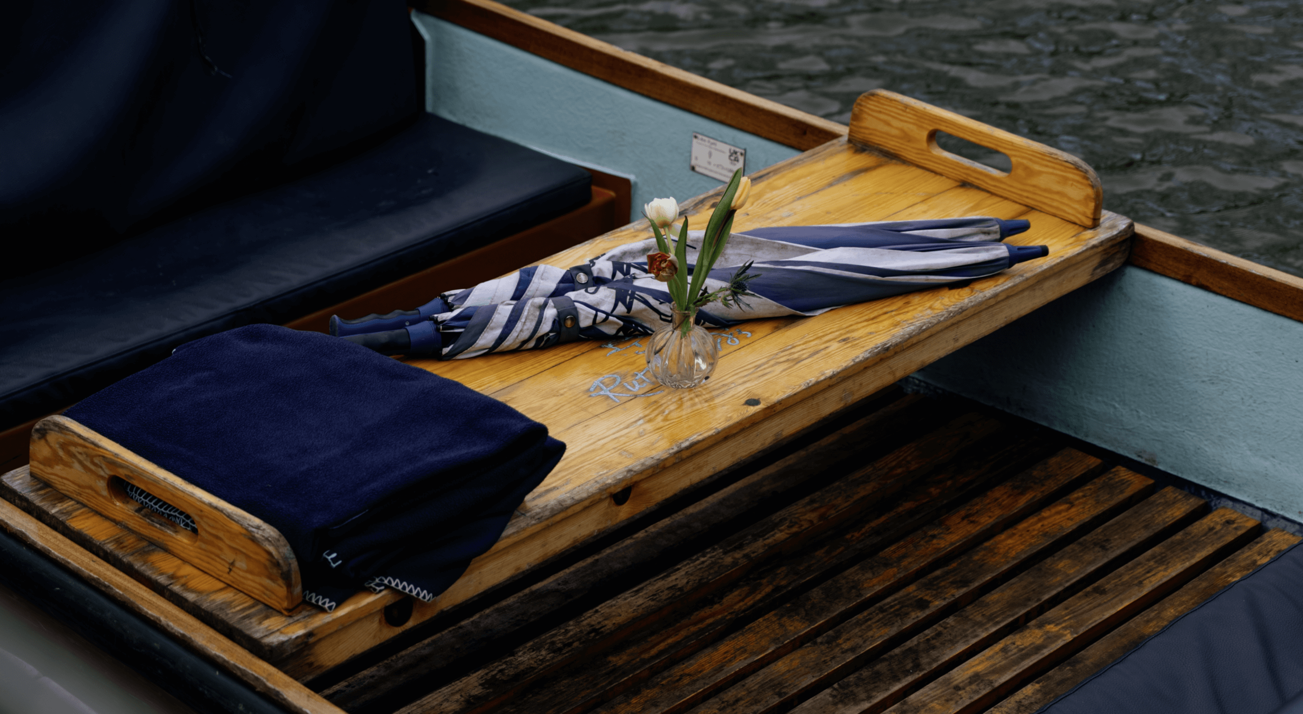Flowers and an umbrella on a Rutherford's Punting Boat