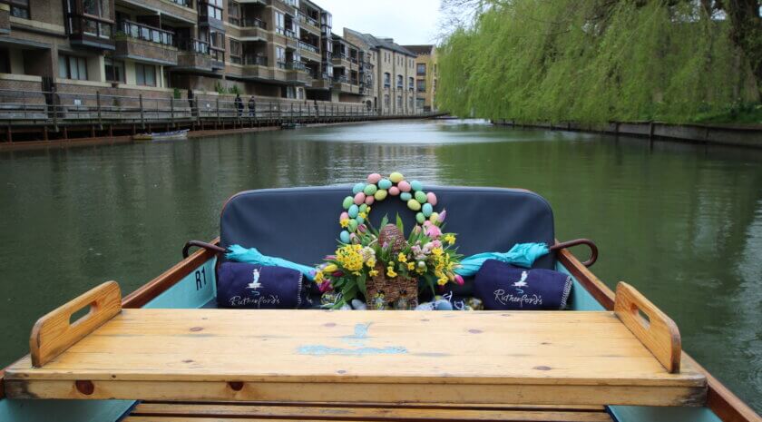 An Easter decorated boat cruising along the River Cam